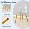 A modern minimalist style round transparent tempered glass table with gold metal legs